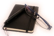 pen, diary and glasses