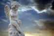 thinking boy with wings statue