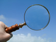 antique magnifying glass in sky