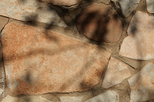 Photo: stone wall with leaf shadows stone wall with leaf shadows