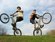 two mountain bikers on second weels