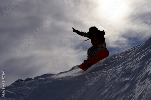 Photo: snowboarder's flying snowboarder's flying