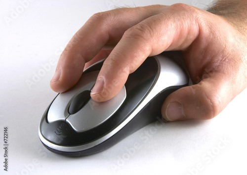 Photo: hand on mouse hand on mouse