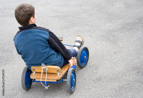 Photo: boy in cart boy in cart