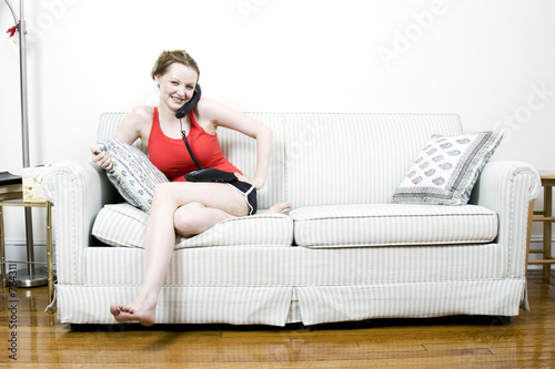 Photo: young woman on the phone young woman on the phone