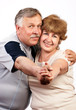 elderly couple smiling.