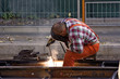 construction worker fixing rails