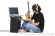boy teenager with electric guitar amp and laptop