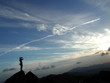 a man standing at the top of the mountain a man standing at the top of the mountain