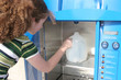hurricane preparedness - girl fills bottle