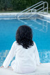 girl watching the water of the swimming pool