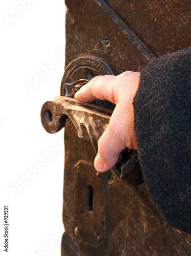 hand on an antique door - opening