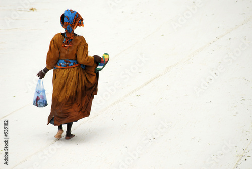 lady walking on the beach