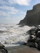 rough sea breaking on rocks and slipway