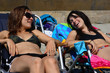 girls tanning on the beach