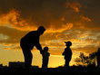 father with children sunset