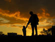 father with baby sunset