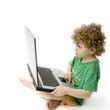 Photo: young child and his computer young child and his computer
