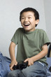 asian kid playing game asian kid playing game