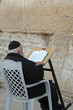 reading scripture at the western wall