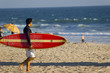 young man with surfboard
