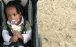 baby in pram eating icecream