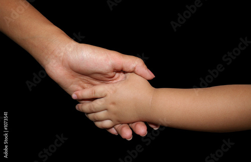 Photo: mother holding daughters hand mother holding daughters hand