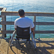 man in wheelchair fishing
