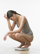 upset woman on scale upset woman on scale