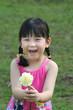 Photo: girl holding flower, smiling girl holding flower, smiling