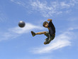 boy playing soccer