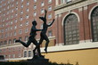 monumental stature in front of building