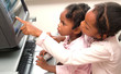 children having fun on home computer