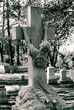 woman kneeling at cross monument