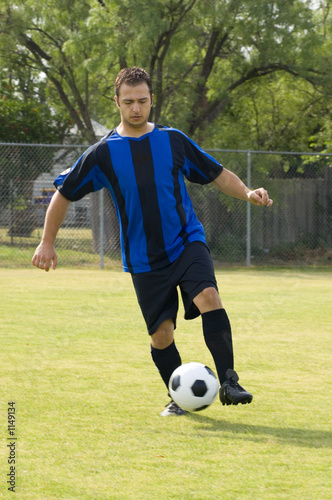 Photo: soccer - football player dribbling soccer - football player dribbling