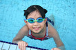 girl with goggles in the pool