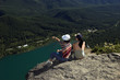 hikers sitting on top of the mountain