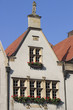 house with statue on the roof.