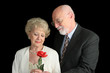 senior couple on black - romantic gesture