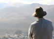 senior man looking out over a valley