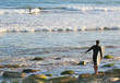 surfer on the rocks