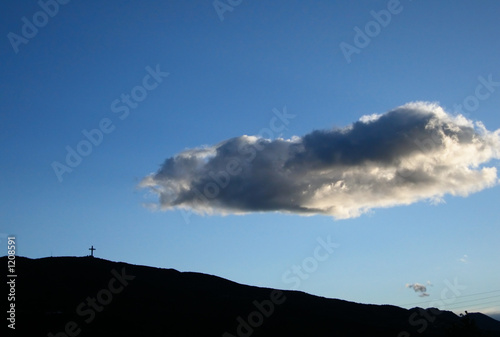 millennium cross and a floating cloud