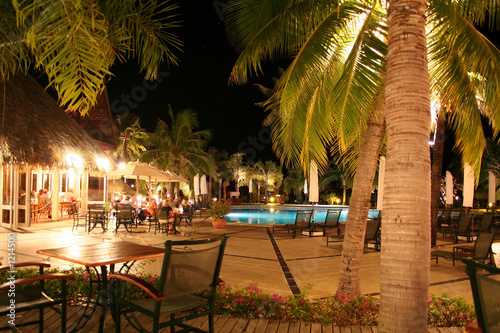 tropical hotel pool at night