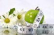 apple, flowers and measurement tape