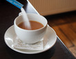 sugar flowing into a cup