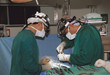 two surgeons operating