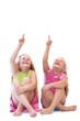 two girls pointing (at your advertisement?)