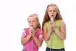 singing girls with microphones