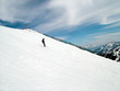 man skiing down mountain