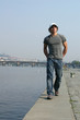 man walking along the embankment